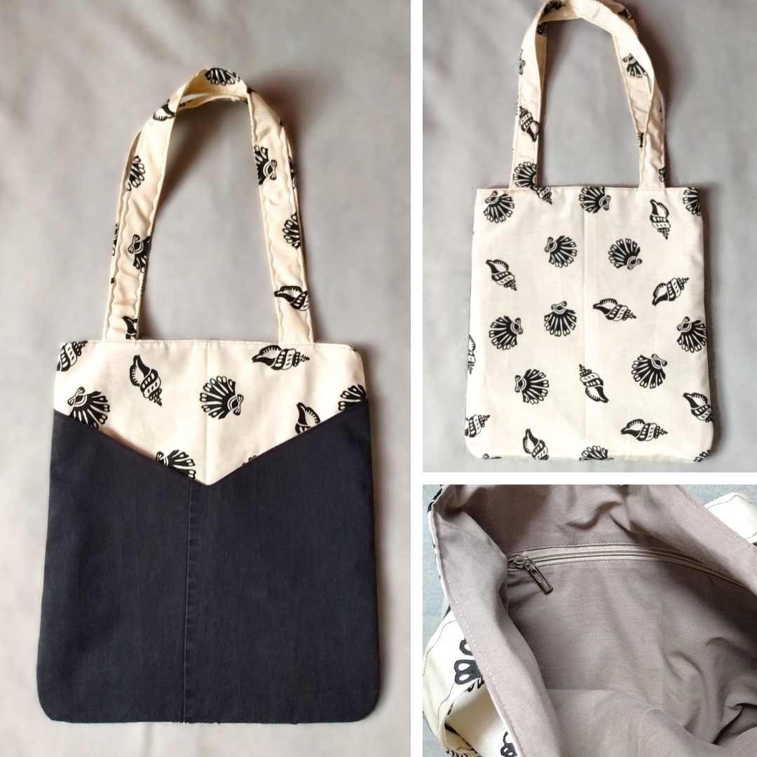 Vue avant, arrière et intérieur sac balad'in coquillages noirs et jean noir.
avant : tissu principal écru irisé à motifs gros coquillages noirs et deux poches plaquées en jean noir. Anses pour porter le sac à l'épaule en tissu principal.
arrière : uniquement en tissu principal, c'est à dire tissu écru irisé à coquillages noirs.
intérieur : tissu coton marron clair, une poche zippée beige et un fermoir magnétique.