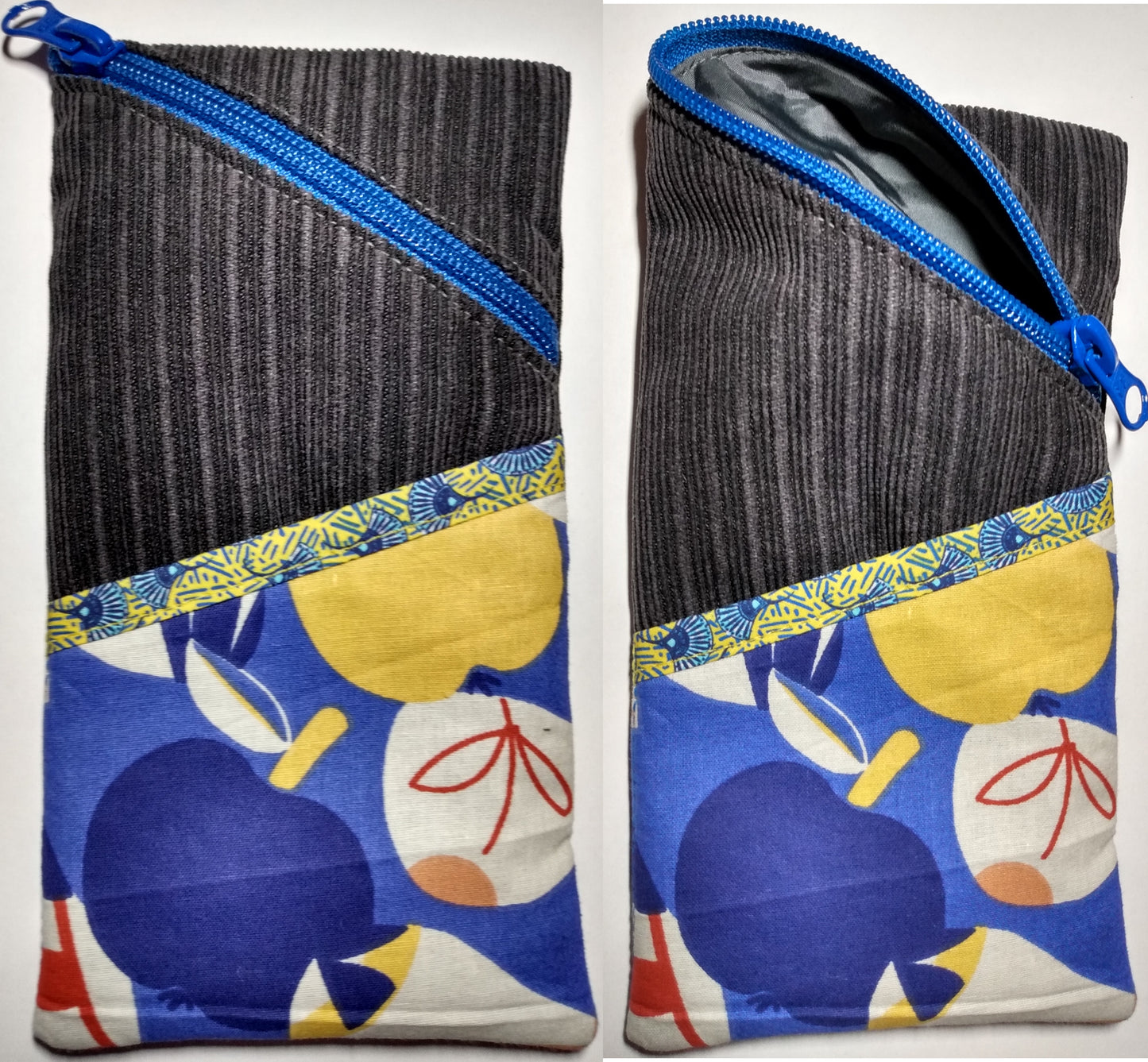 Étui à lunettes velours gris anthracite. Se ferme avec un zip bleu. A l'extérieur, une poche bleue motif pommes multicolores, surmontée d'un biais jaune motif éventails bleus est visible à l'avant, sur la moitié basse de l'étui. L'intérieur est uni gris.
